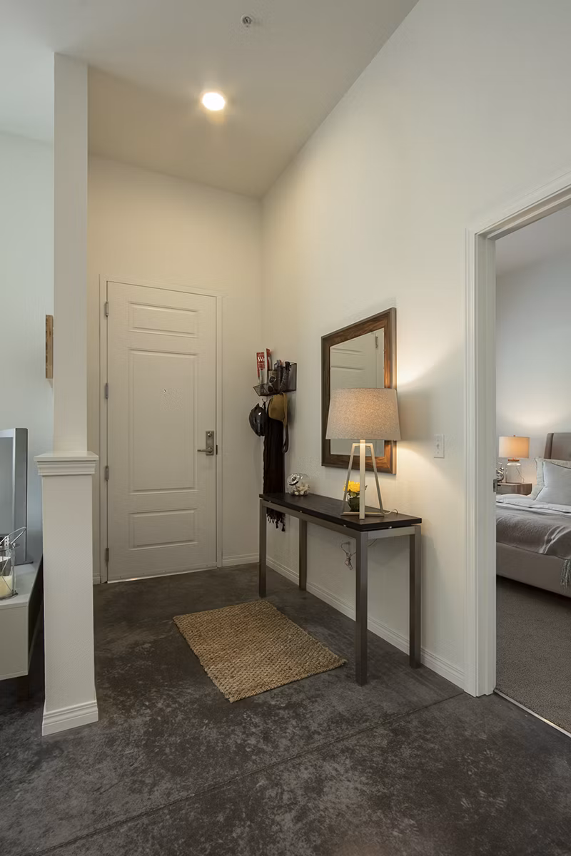 Contemporary hallway with sleek lighting and wall art at Spencer 68 Apartments