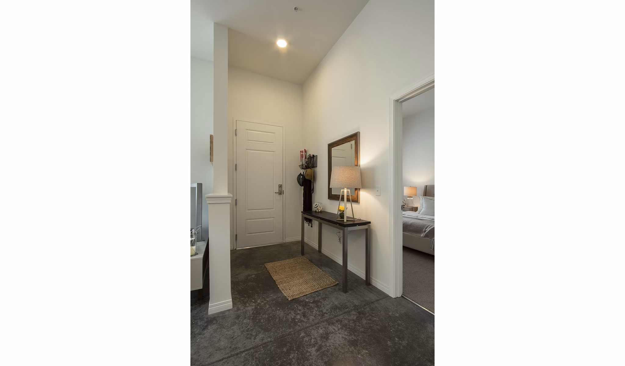 Contemporary hallway with sleek lighting and wall art at Spencer 68 Apartments