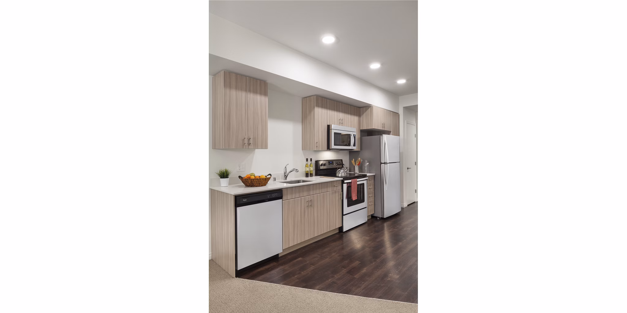 Modern kitchen featuring stainless steel appliances in Spencer 68 Apartments