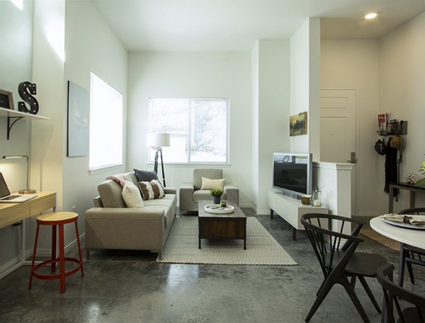 Spacious living room with contemporary furnishings in Spencer 68 Apartments