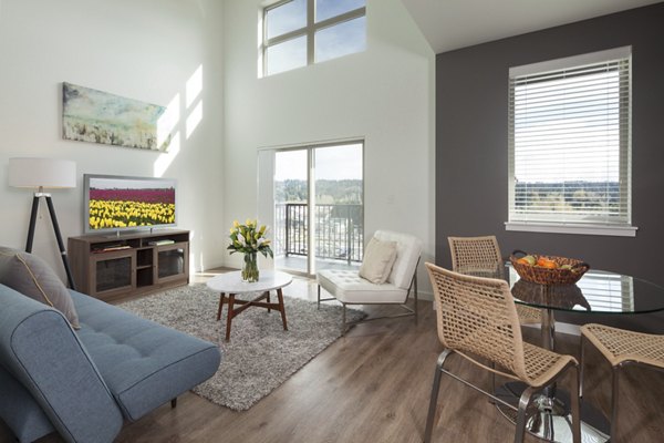 Luxurious living room with modern design and cozy seating at Spencer 68 Apartments in Kenmore, embodying elegant comfort and style