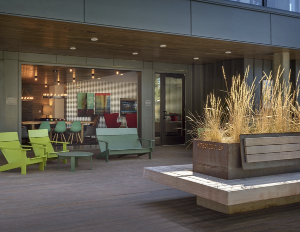 Chic outdoor patio space with stylish seating at Spencer 68 Apartments, perfect for relaxation and gatherings