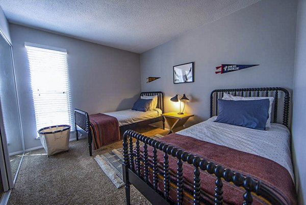 Cozy bedroom with modern decor at The Mica Apartments, luxury living space for relaxation