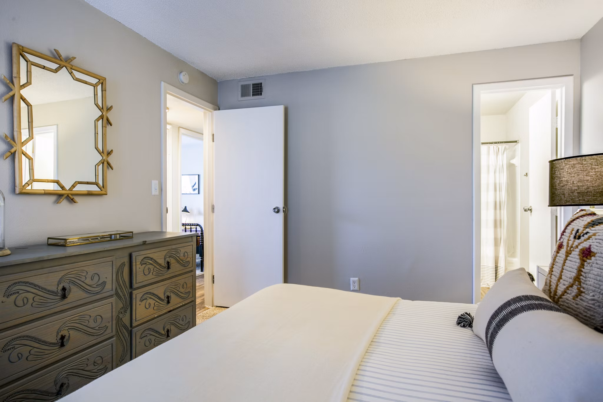 Elegant bedroom with modern decor at The Mica Apartments in downtown Seattle, offering luxury living in Greystar's renowned style