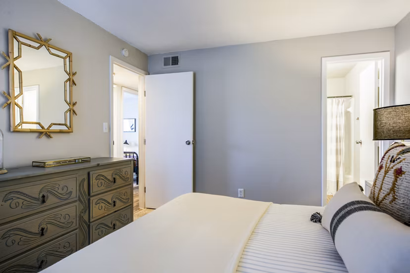 Elegant bedroom with modern decor at The Mica Apartments in downtown Seattle, offering luxury living in Greystar's renowned style