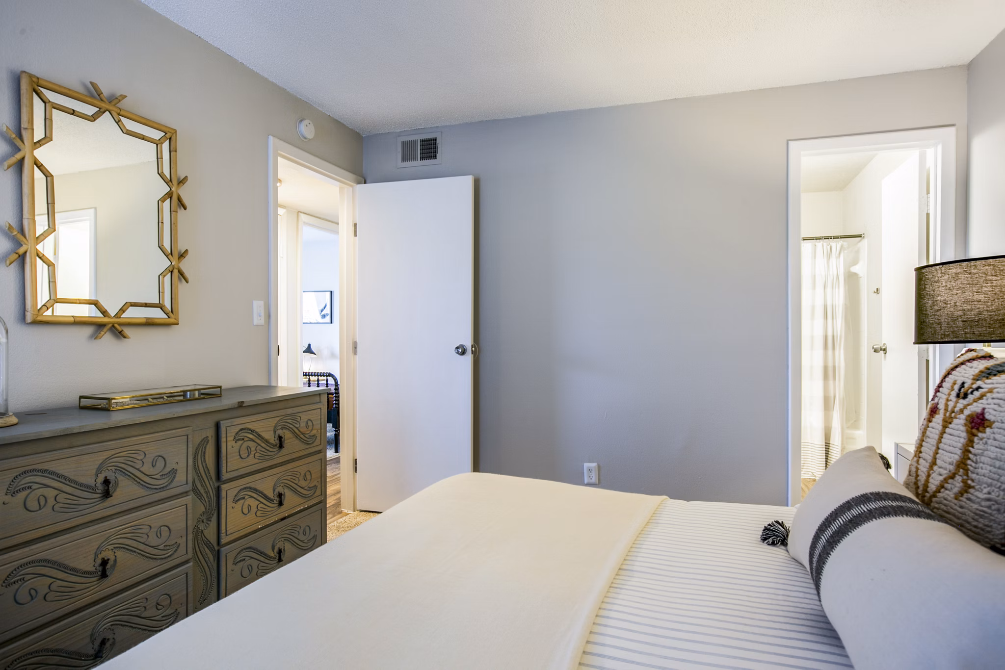 Elegant bedroom with modern decor at The Mica Apartments in downtown Seattle, offering luxury living in Greystar's renowned style