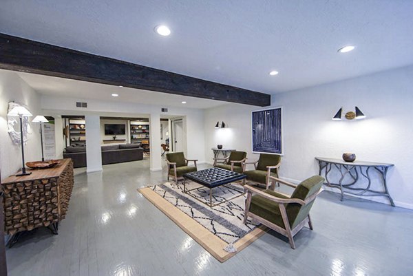 Clubhouse featuring modern seating and entertainment options at The Mica Apartments