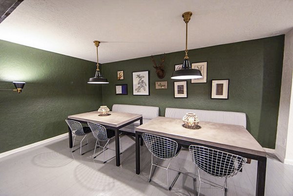 Spacious clubhouse with modern decor at The Mica Apartments, perfect for social gatherings and relaxation in a luxurious setting