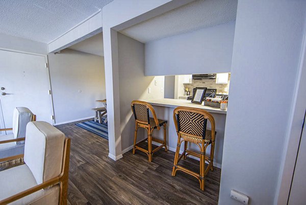 Sleek dining room with elegant furnishings at The Mica Apartments, a prime example of Greystar's luxury living spaces