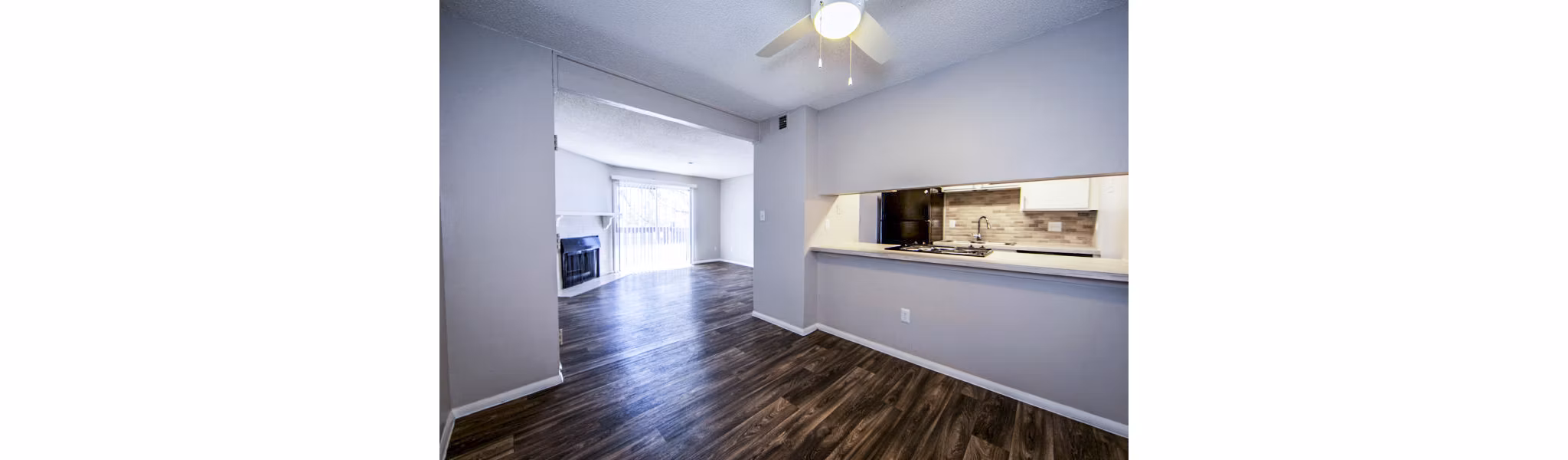 Dining area with elegant lighting and contemporary furnishings at The Mica Apartments