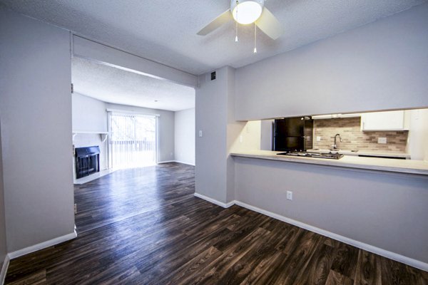 Dining area with elegant lighting and contemporary furnishings at The Mica Apartments