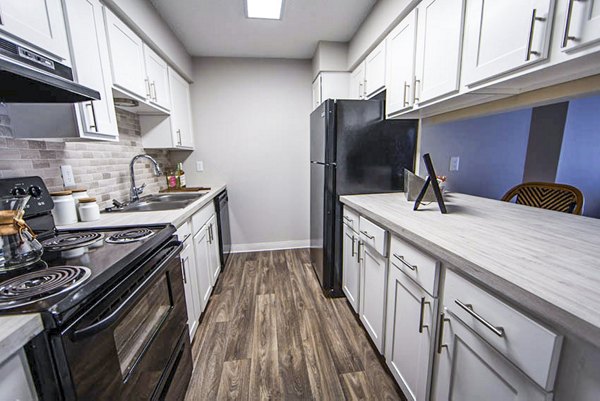 Modern kitchen with stainless steel appliances in The Mica Apartments
