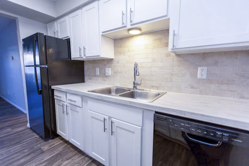 Modern kitchen with stainless appliances at The Mica Apartments, San Francisco - luxury living in a Greystar community