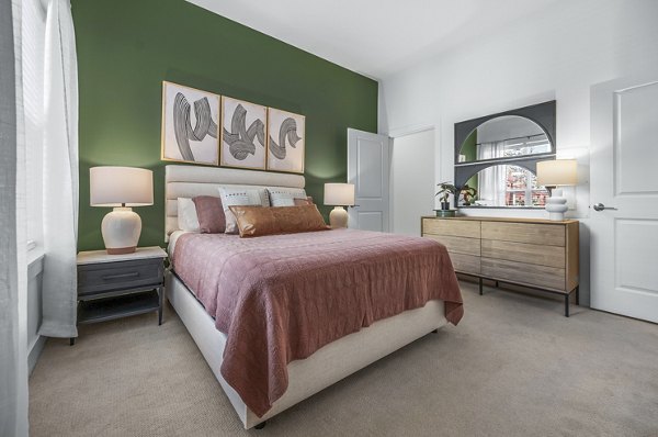 Modern bedroom with sleek furnishings at Atmark Apartments in Cambridge