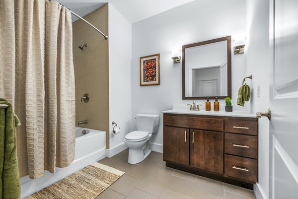 Modern bathroom with sleek fixtures at Atmark Apartments, offering luxurious features and contemporary design for a comfortable living experience