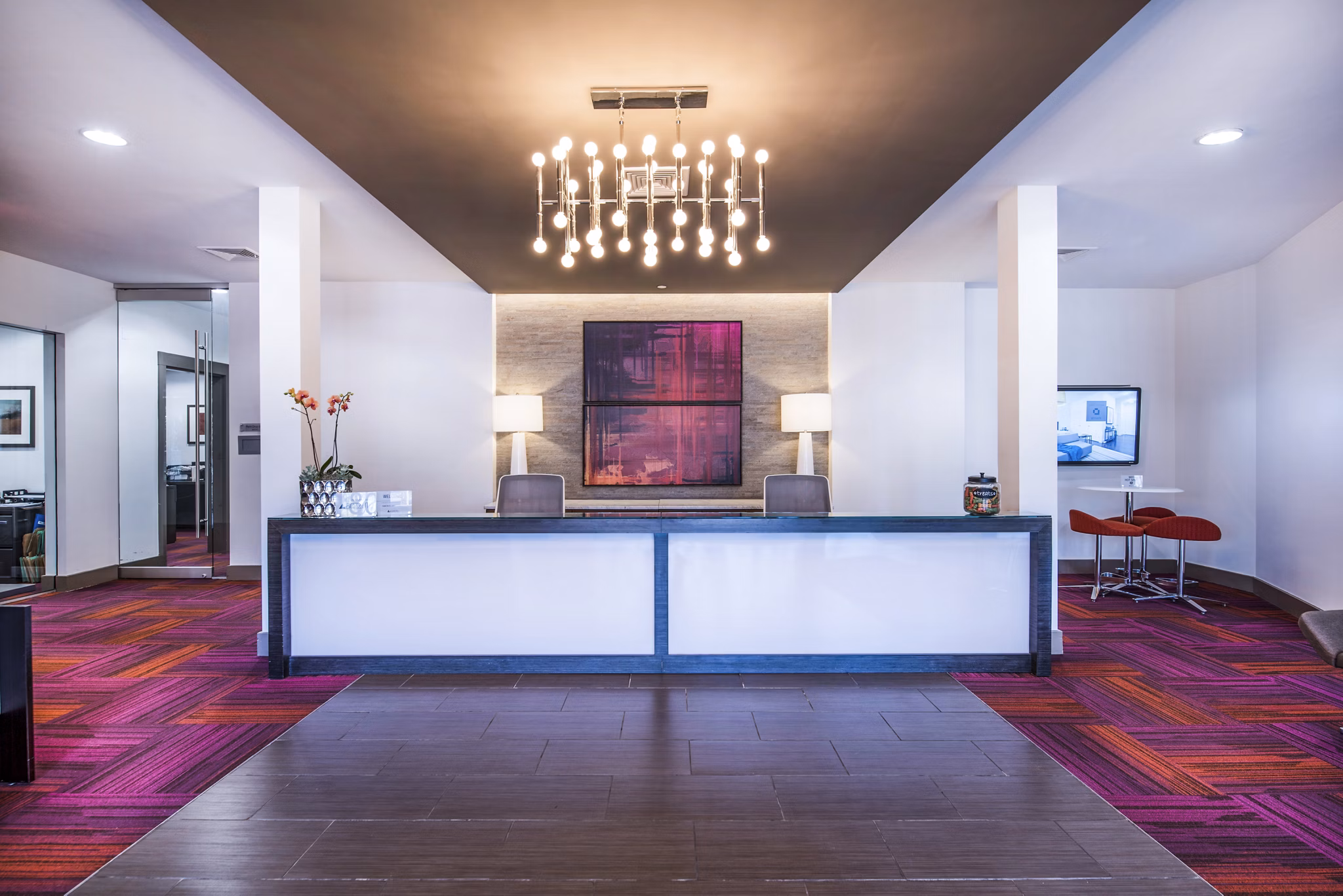 Modern lobby with contemporary design in Atmark Apartments, featuring spacious seating and elegant lighting, perfect for social gatherings