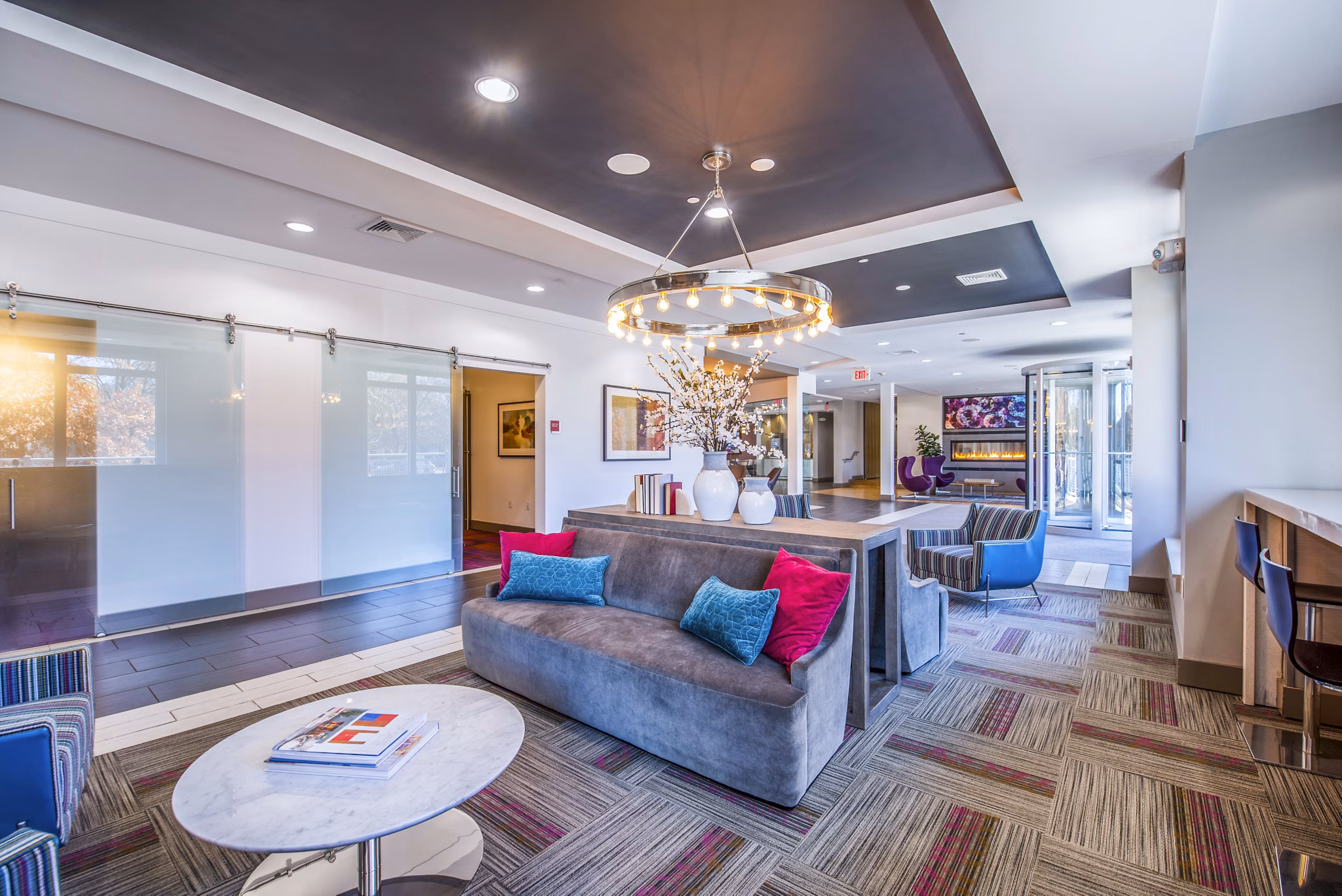 Modern clubhouse/lobby featuring contemporary furnishings and art at Atmark Apartments, a luxury community by Greystar