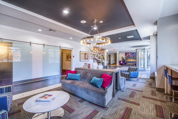 Modern clubhouse/lobby featuring contemporary furnishings and art at Atmark Apartments, a luxury community by Greystar