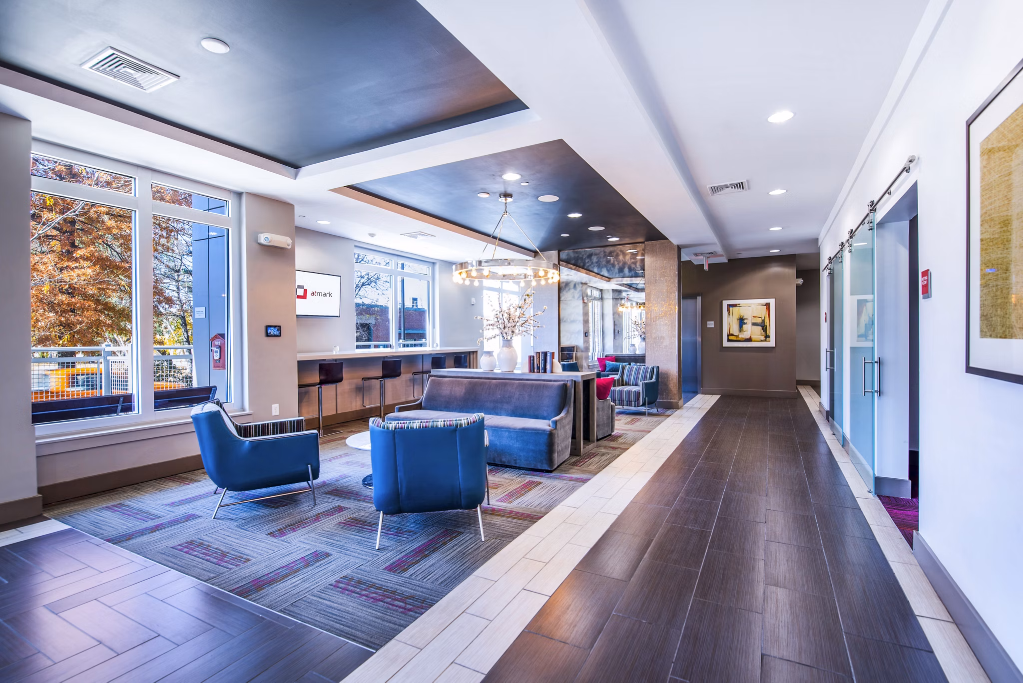Elegant clubhouse lobby with contemporary seating at Atmark Apartments