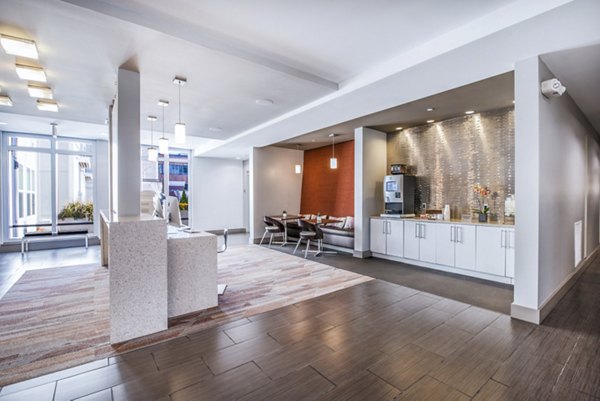 Inviting clubhouse lobby with modern furnishings at Atmark Apartments, a luxury community by Greystar