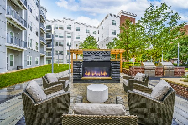 fire pit/grill area at Atmark Apartments 