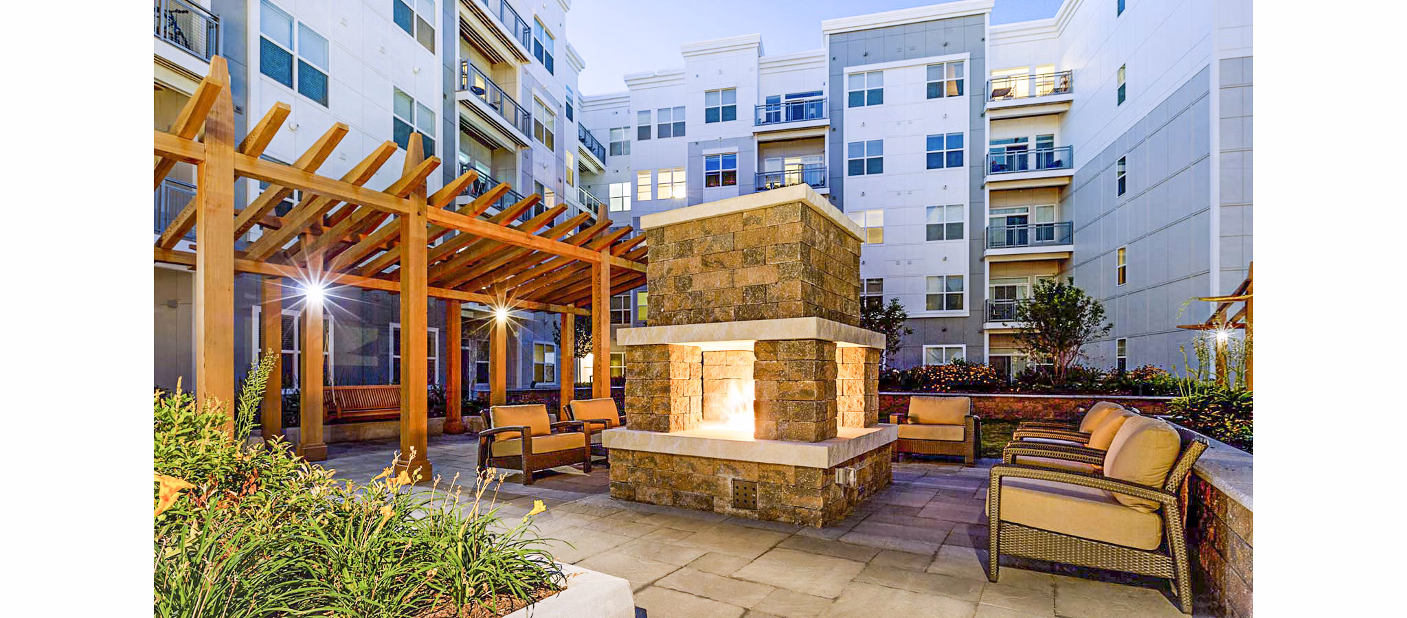 Cozy outdoor fire pit area at Atmark Apartments