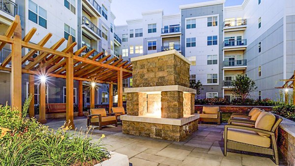 Cozy outdoor fire pit area at Atmark Apartments