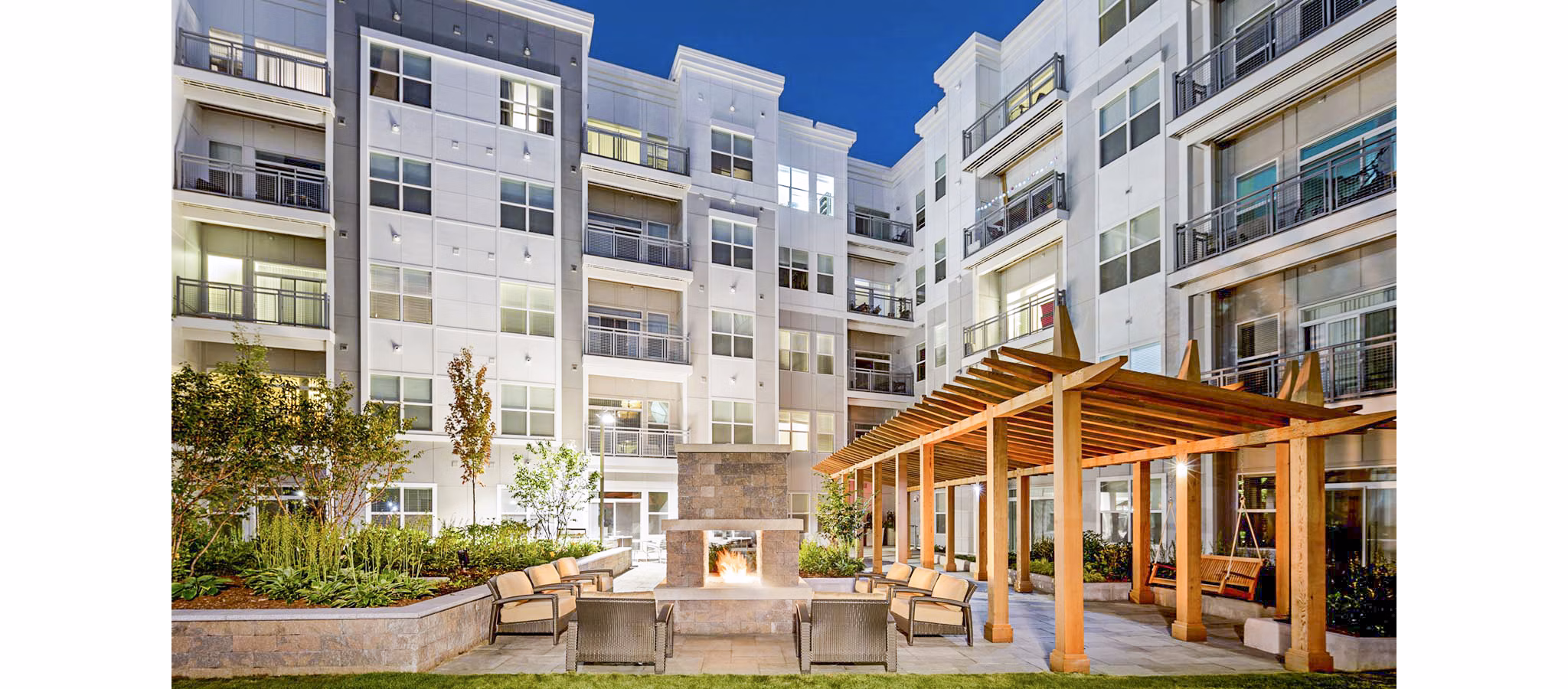 Cozy fire pit on patio at Atmark Apartments, perfect for socializing and relaxing in a Greystar community