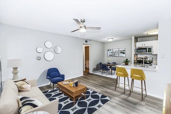 Spacious living room with contemporary furnishings at Ridgemont at Stringers Ridge Apartments