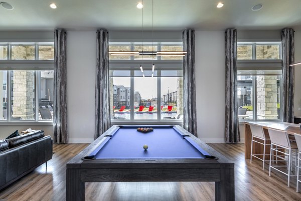 Stylish clubhouse at Prose Magnolia Apartments featuring modern decor and ample seating for social gatherings