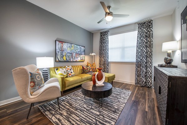Bright living room with stylish furnishings at Prose Magnolia Apartments, perfect for luxury living in a modern setting