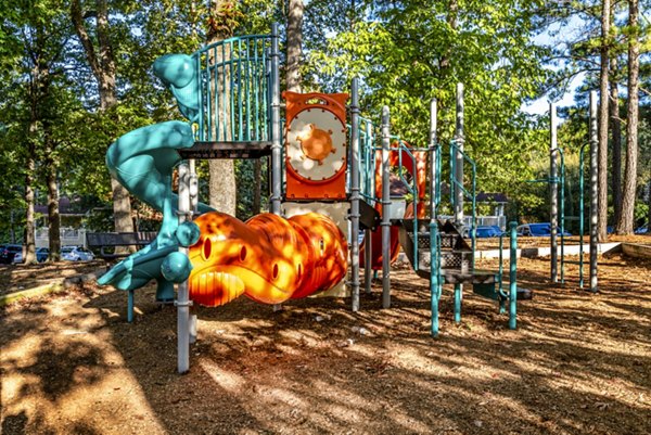Playground with slides and climbing structures in luxury apartment community