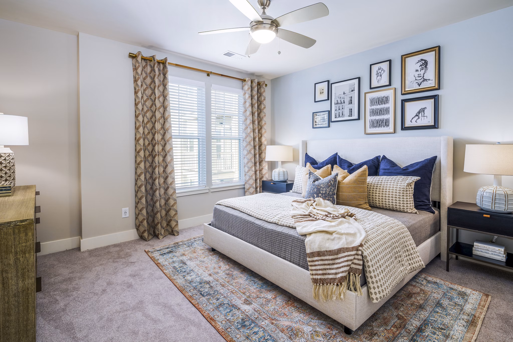Cozy bedroom with stylish decor in Album Indian Lake Apartments, featuring modern furniture and soft lighting for a relaxing ambiance