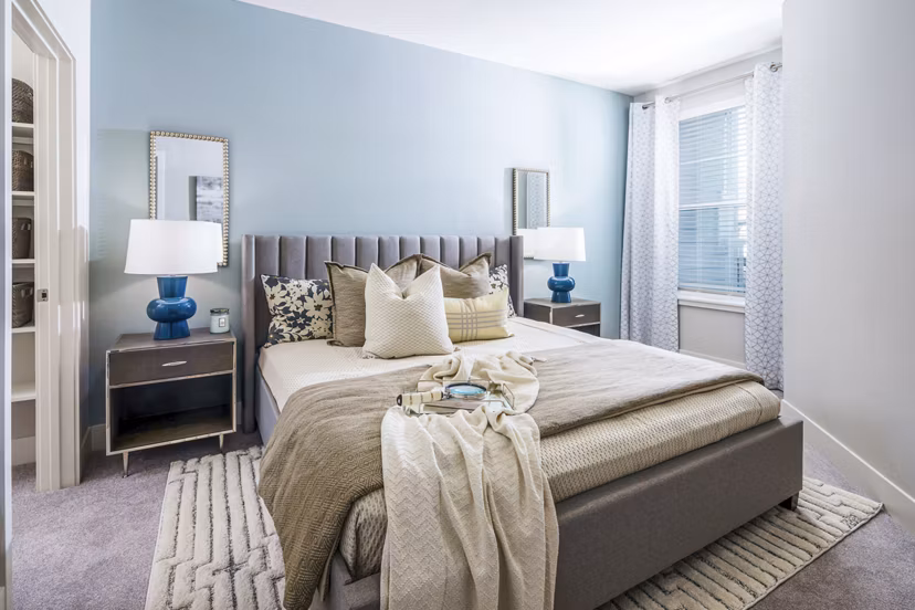 Cozy bedroom with modern furnishings at Album Indian Lake Apartments