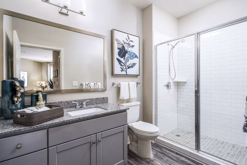 Bathroom with sleek modern design at Album Indian Lake Apartments, offering luxury living near  training facilities