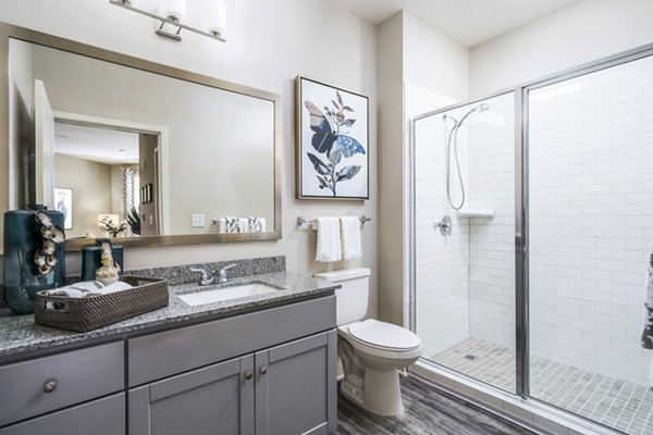 Bathroom with sleek modern design at Album Indian Lake Apartments, offering luxury living near  training facilities