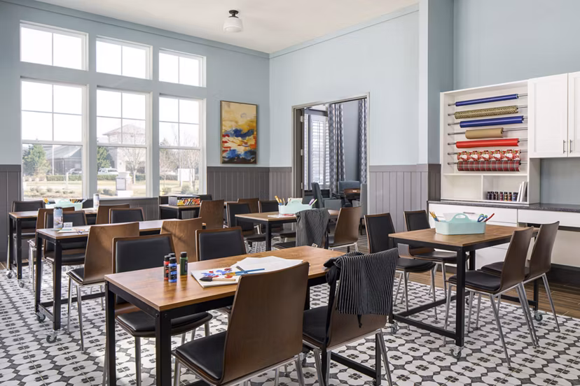 Clubhouse with cozy seating and pool table at Album Indian Lake Apartments, a Greystar luxury community in a relaxing atmosphere
