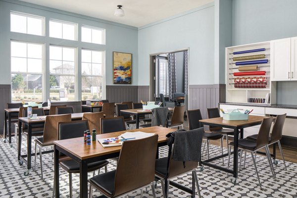 Clubhouse with cozy seating and pool table at Album Indian Lake Apartments, a Greystar luxury community in a relaxing atmosphere