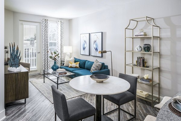 Spacious living room with modern furnishings at Album Indian Lake Apartments
