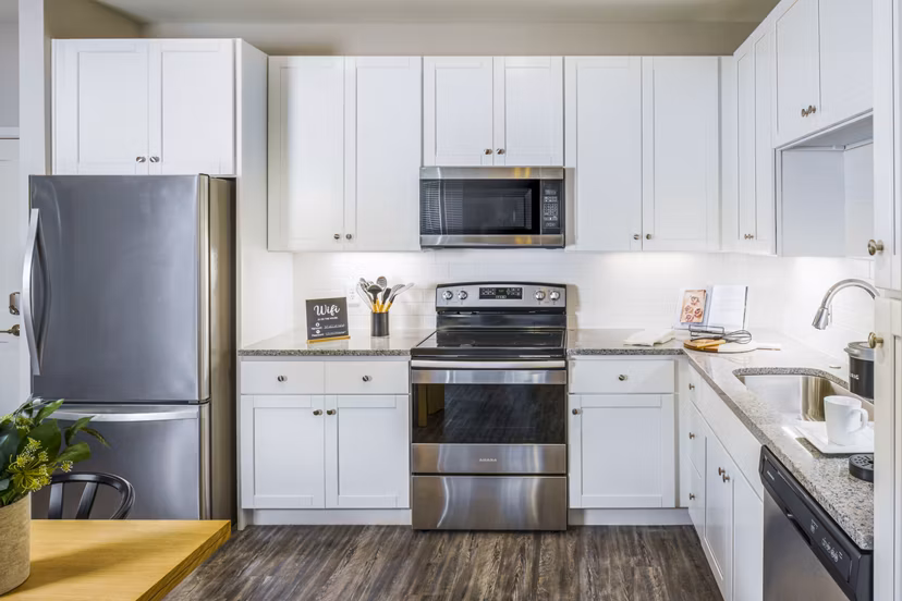Modern kitchen with stainless steel appliances at Album Indian Lake Apartments