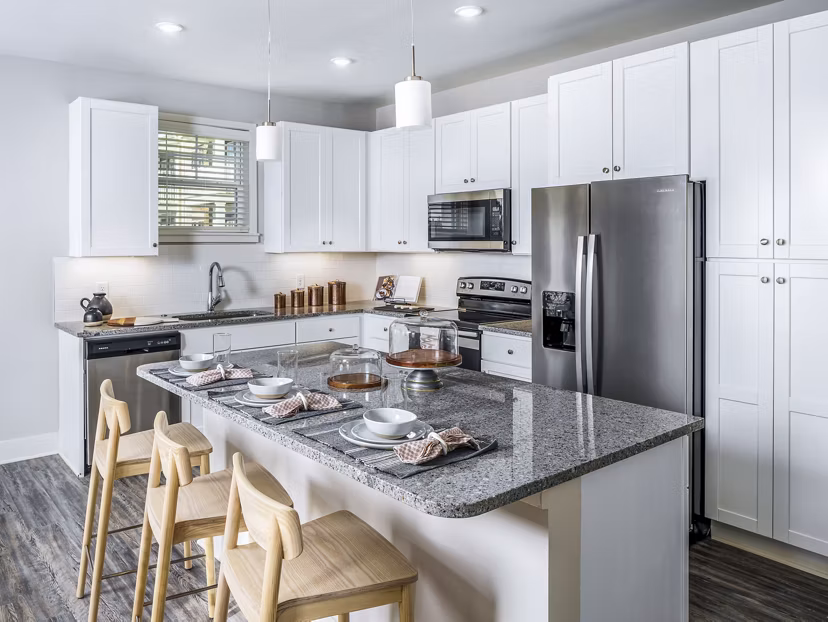 Modern kitchen with sleek countertops and stainless steel appliances at Album Indian Lake Apartments