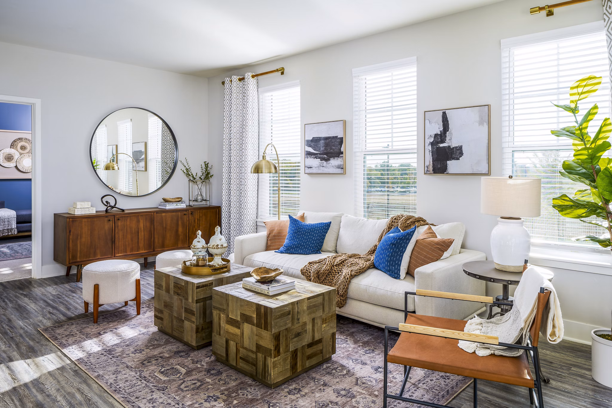 Spacious living room with modern decor and ample natural light at Album Indian Lake Apartments