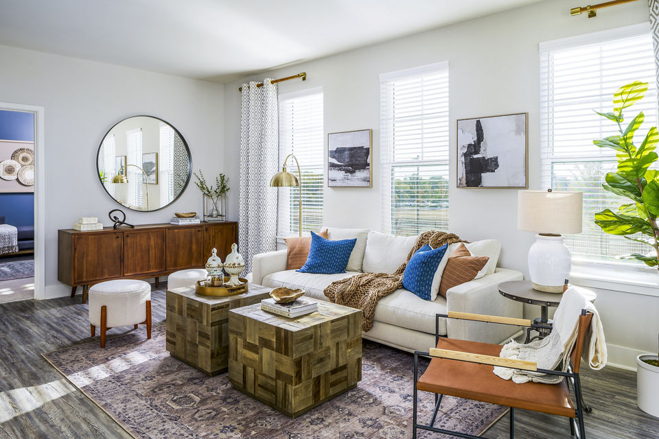 Spacious living room with modern decor and ample natural light at Album Indian Lake Apartments