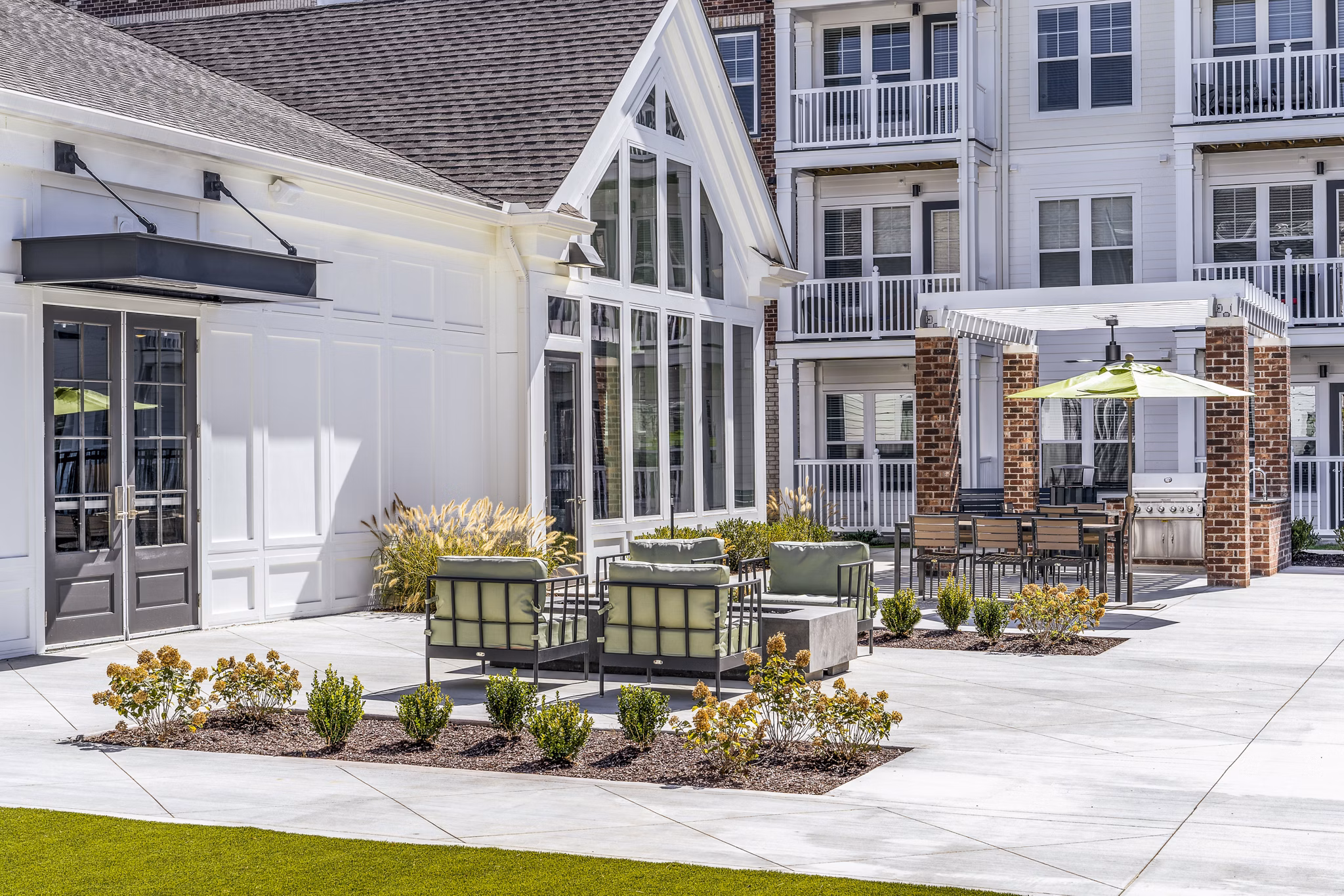 Outdoor grill area on the patio at Album Indian Lake Apartments, perfect for social gatherings and relaxation