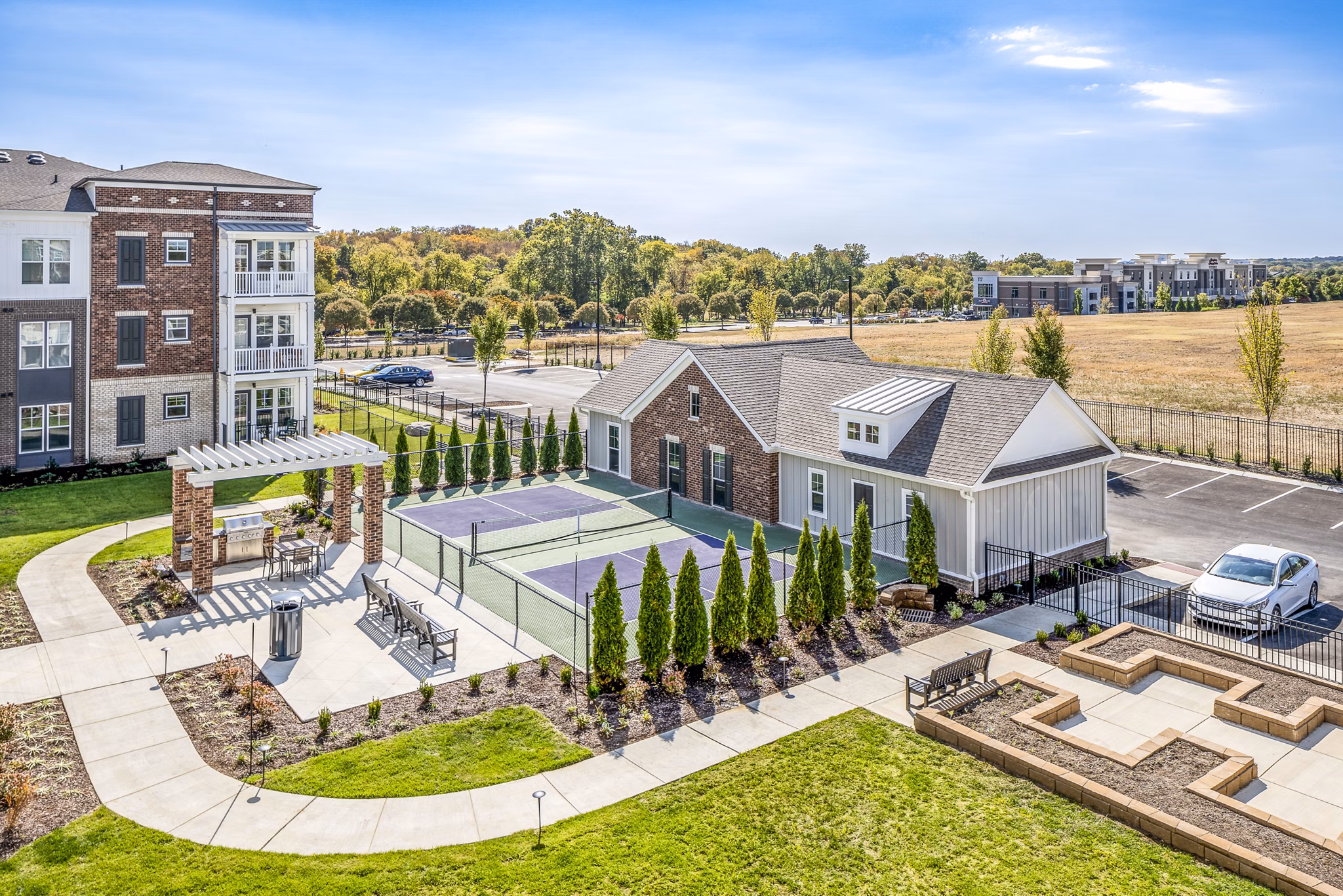 Outdoor grill area on spacious patio at Album Indian Lake Apartments