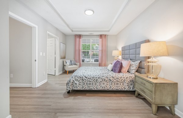 Elegant bedroom with plush bedding and modern decor at Avana Thornblade Apartments