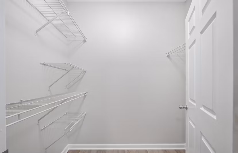 Spacious walk-in closet with custom shelving in Avana Thornblade Apartments