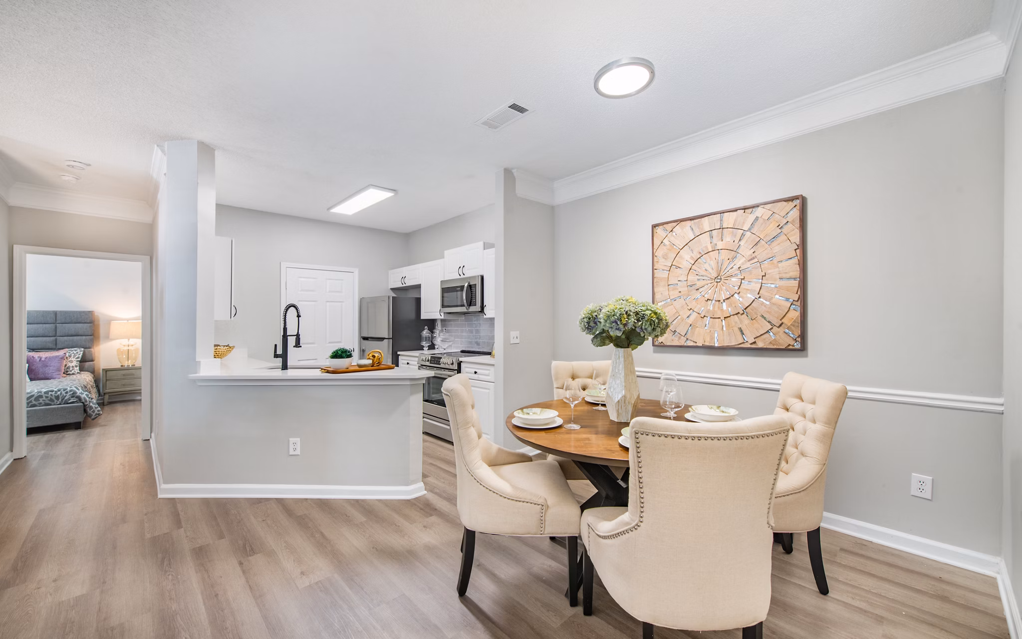 Dining area with elegant furnishings at Avana Thornblade Apartments, featuring modern design and ample natural light