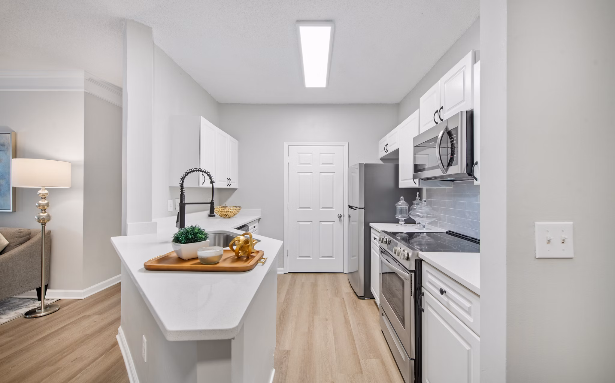 Modern kitchen with stainless steel appliances at Avana Thornblade Apartments