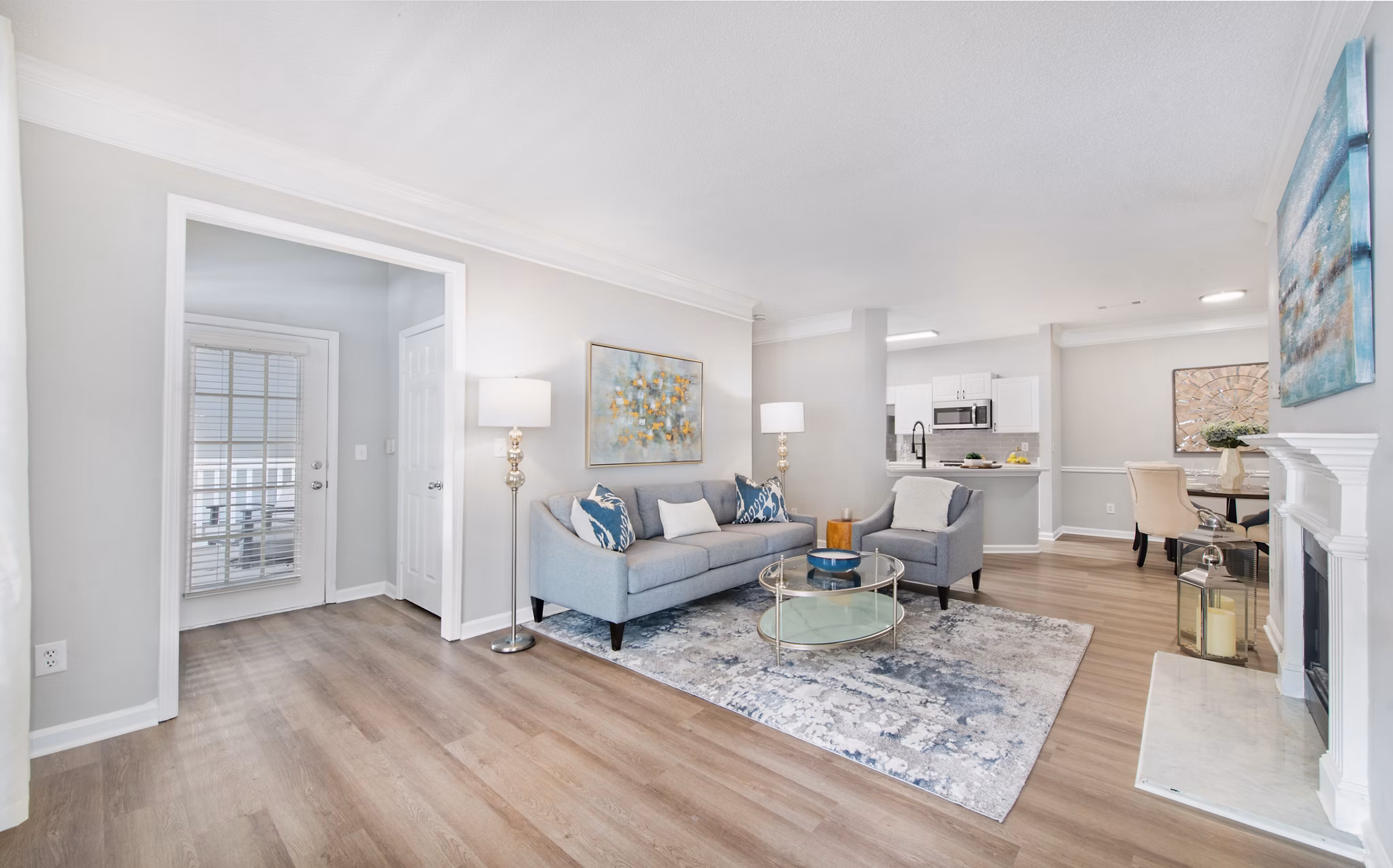Living room with cozy sectional sofa and modern decor at Avana Thornblade Apartments